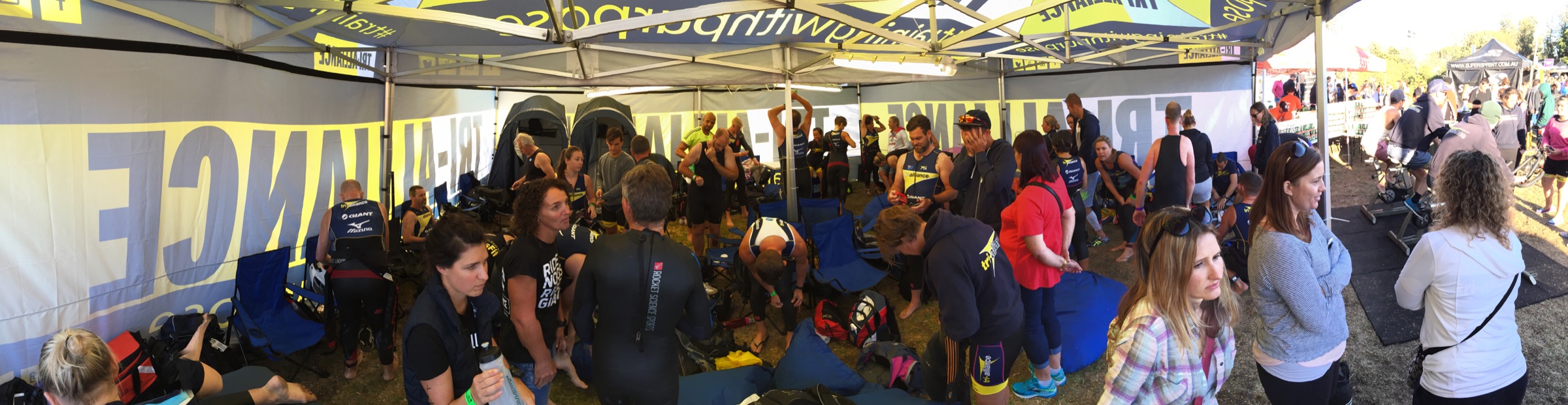 Tri Alliance athletes and supporters gathered around a busy transition tent