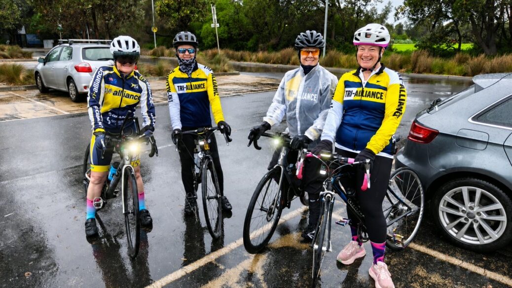 Four Tri Alliance women with their bikes after a cold, wet and windy Elwood ride