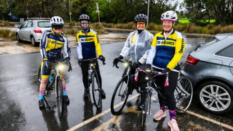 Four Tri Alliance women with their bikes after a cold, wet and windy Elwood ride